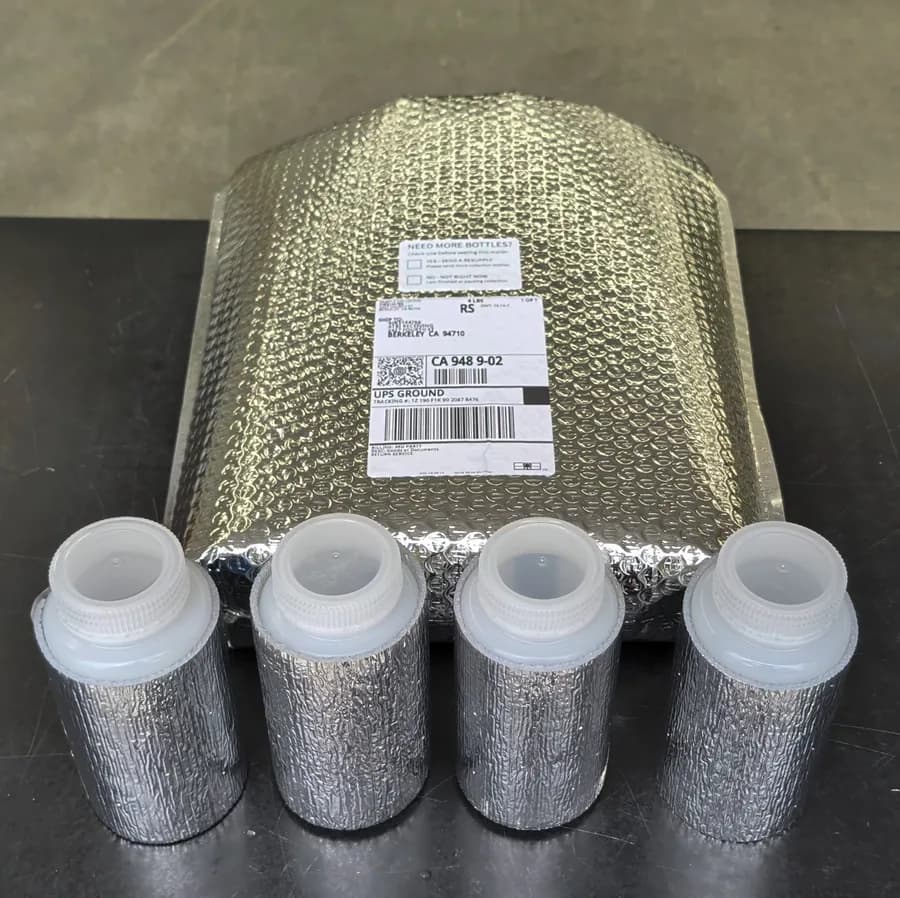 Capped collection bottles with supplied return packaging.